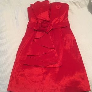 Red strapless cocktail dress with rose detail